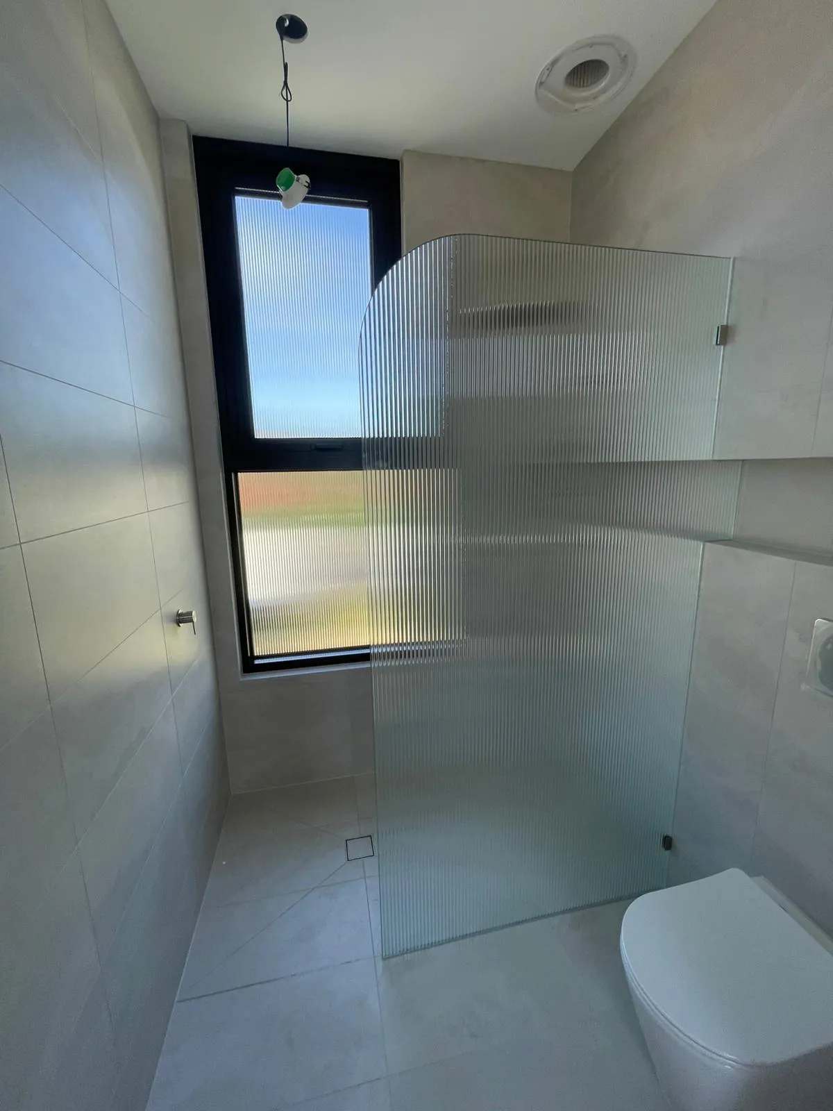 Reeded privacy glass catching window light